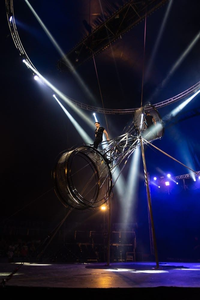 Rodrigo Gomez high on the wheel under the big top, Le Cirque Amar.