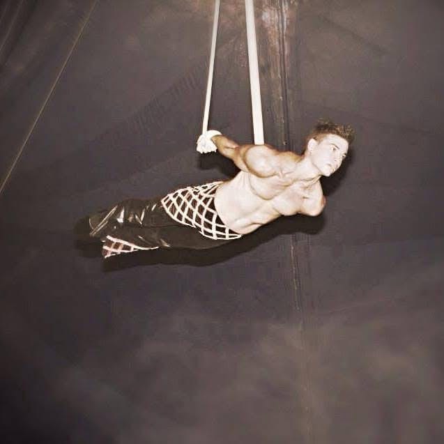 Rodrigo Gomez suspended in aerial straps.